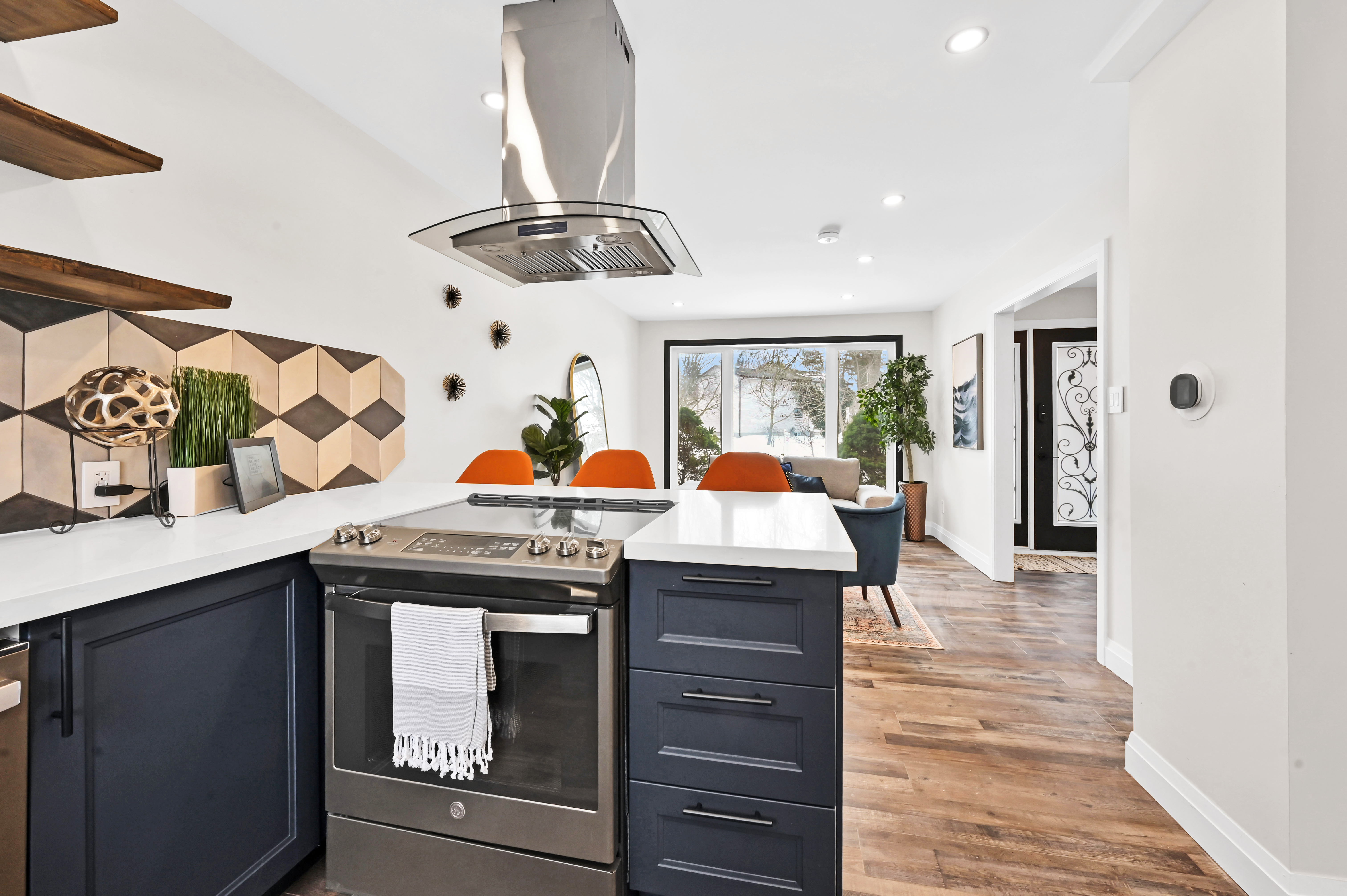 Stunning finished kitchen with dramatic material contrast, perfect staging, and bright natural light — Kron, Hamilton | MTC Renovations